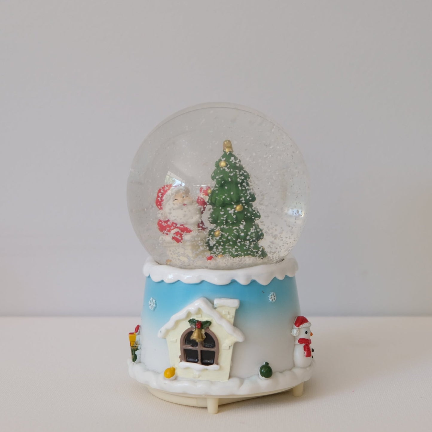 Boule à neige rotative bleue de Noël